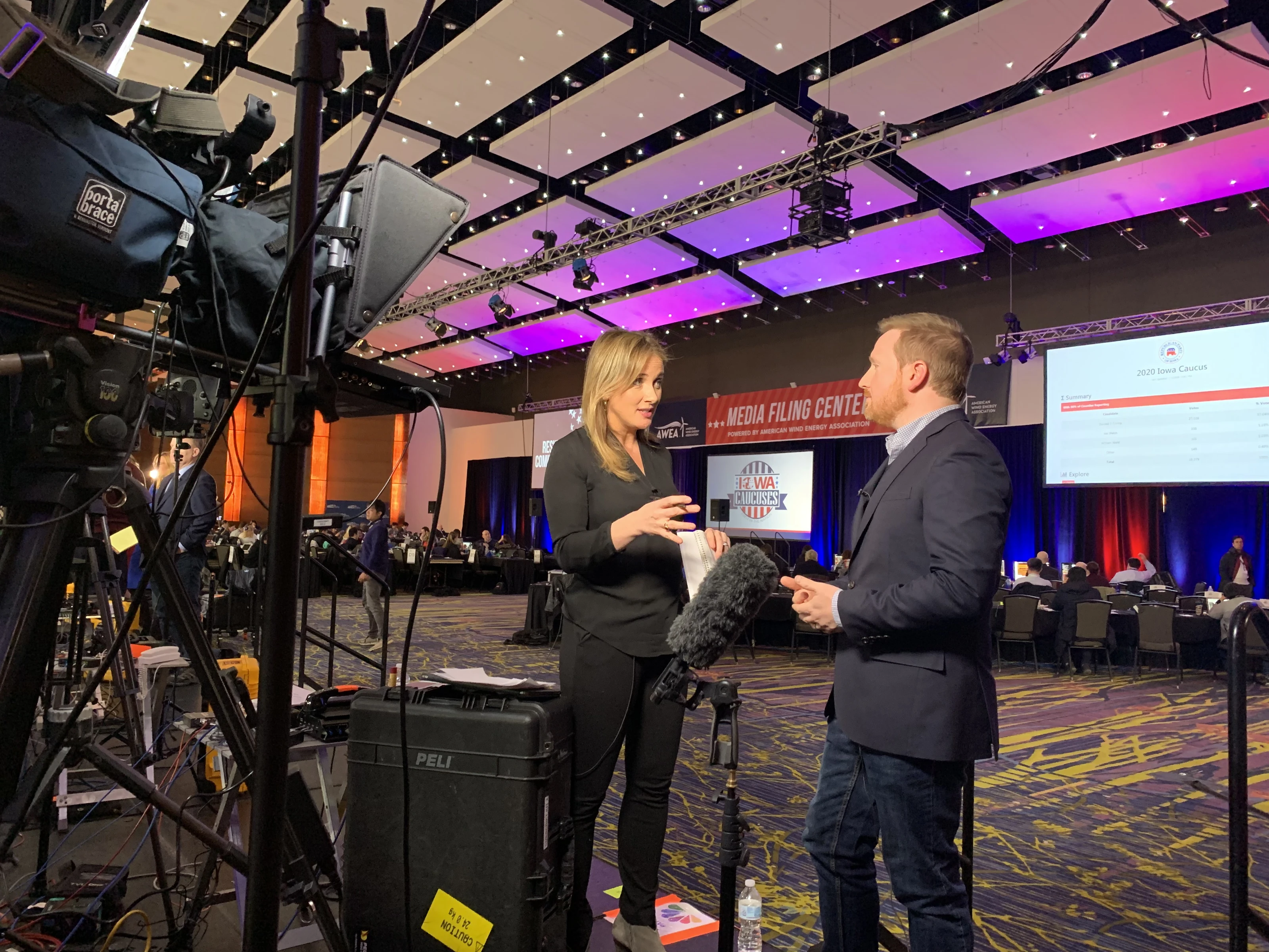 Conference interview in front of broadcast cameras